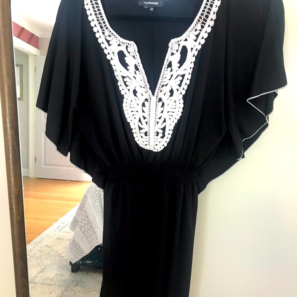 Black knee length dress with white lace detail